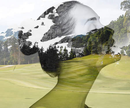 Double exposure portrait of attractive lady combined with photograph of nature.の写真素材