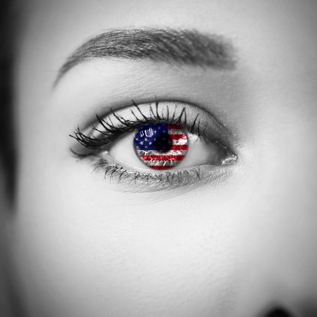 Close-up female eye with american country flag