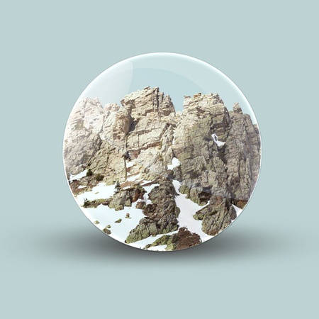 Crystal ball in mountain at morning on the green backgroundの写真素材