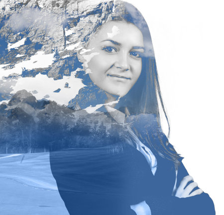 Double exposure portrait of attractive girl combined with photograph of snowy mountainの写真素材