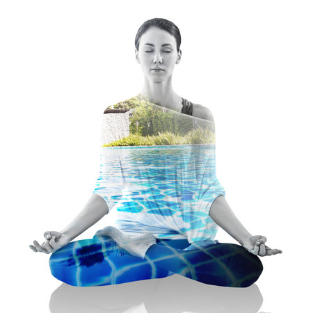 Double exposure portrait of woman in lotus position and natureの写真素材