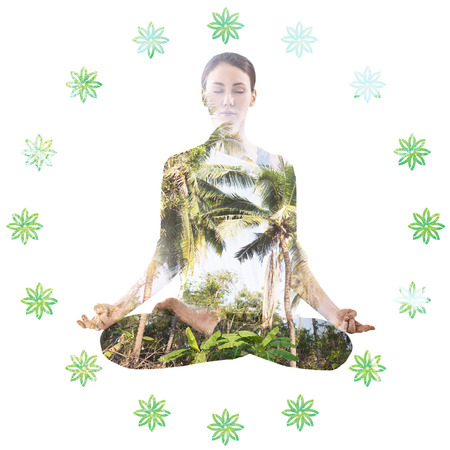 Double exposure portrait of woman in lotus position and natureの写真素材