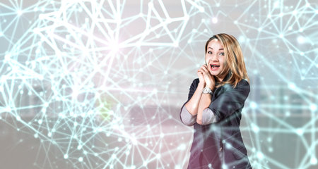 Young attractive woman standing in digital lights and lines.