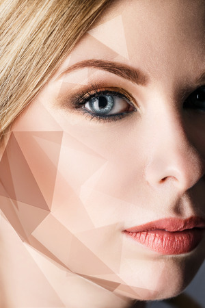 Close-up portrait of young woman with geometrical shapes on face.の写真素材