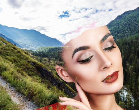 Double exposure portrait of young woman and nature landscapeの写真素材