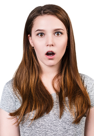 Portrait of young surprised girl with open-mouthの写真素材