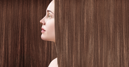 Beautiful woman with luxurious long brown hair.の写真素材