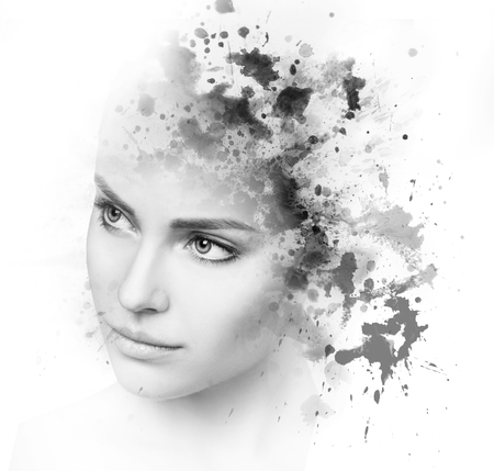 Double exposure of young woman and blotsの写真素材