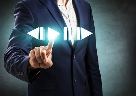 Businessman pressing simple virtual play button.の写真素材