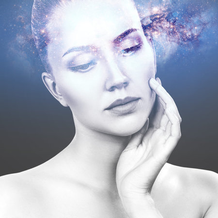 Abstract image of woman face and cosmic galaxy.の写真素材