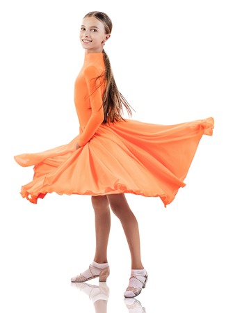 Little dancer girl in beautiful ballroom dress.の写真素材