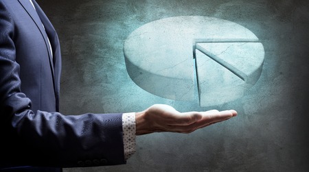 Businessman hand showing white digital pie graph.の写真素材