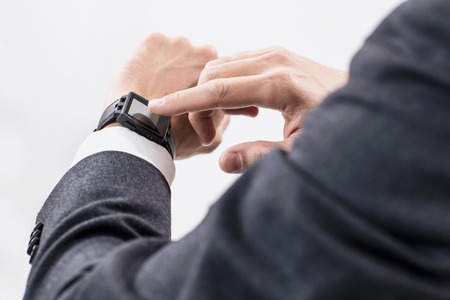 Closeup hands of man using his smartwatch.の写真素材