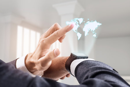 Hand point on virtual map from his smartwatch.の写真素材