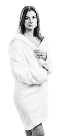 Young sensual woman in white bathrobe.の写真素材