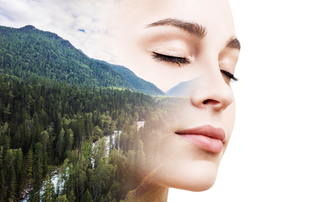 Young woman combined with photograph of nature.の写真素材