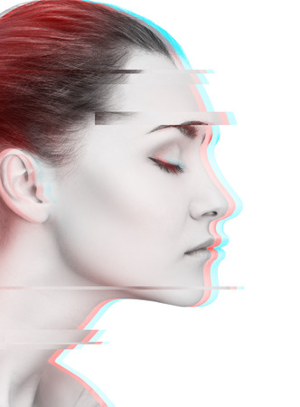 Glitched portrait of young woman in profile viewの写真素材