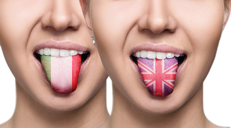 Collage of young woman shows painted tongue with different flags.の写真素材