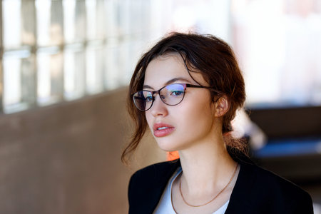 Young brunette woman in formal wear.