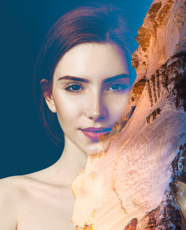 Double exposure portrait of young redhead woman and clouds sea.