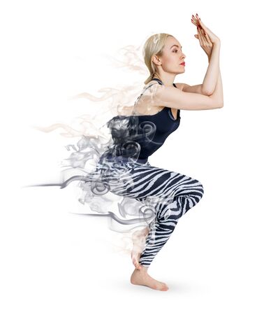 Woman in yoga posture decay on smoke.の写真素材