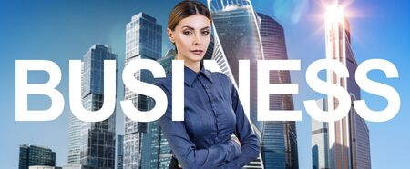 Business woman among big letters of tag word BUSINESS.の写真素材