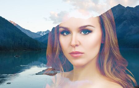 Double exposure of woman and calm blue lake nature landscape.の写真素材