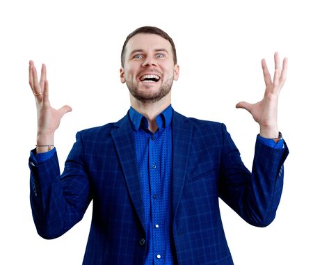 Young businessman feels triumph with crazy face.の写真素材