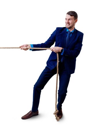 Young businessman pulls a rope.の写真素材