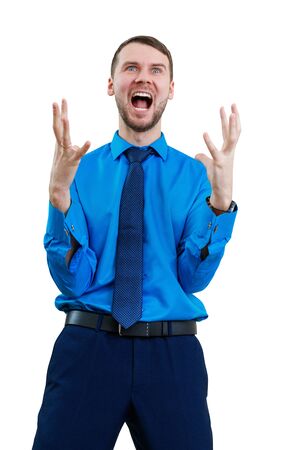 Young businessman feels triumph with crazy face.の写真素材