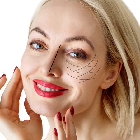 Graphic lines shows facial lifting effect on skin of beautiful woman.の写真素材