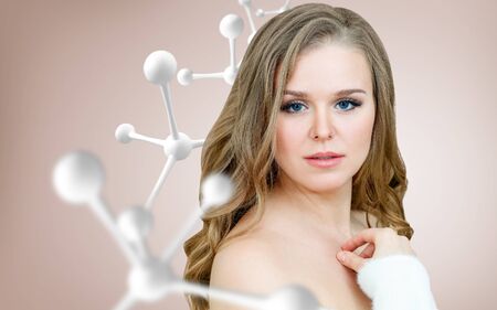 Beautiful woman near big white molecule chain.の写真素材