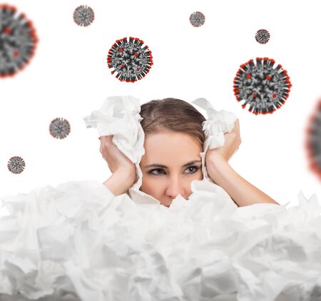 Young woman with a lot of hankys among coronavirus cells.の写真素材