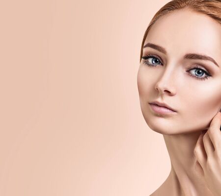Redhead woman with perfect skin with copy space.の写真素材