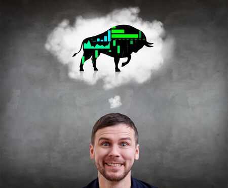 Happy businessman with bull forex icon in white cloud.の写真素材