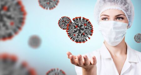Female doctor presents viral cell coronavirus.の写真素材