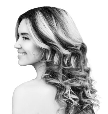 Beauty portrait of blonde woman with wavy hair.の写真素材
