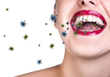 Coronavirus cells fly out from oprn mouth of young woman.の写真素材