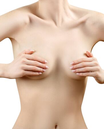Portrait of naked redhead woman covering breast by hands.の写真素材