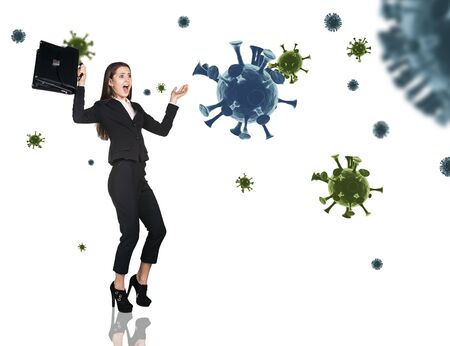Young businesswoman panic among coronavirus cells.の写真素材