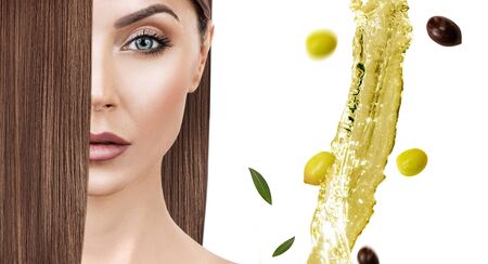 Flying green olive splash near woman with long hair.の写真素材