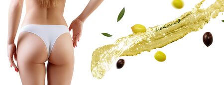 Female buttocks near olive oil splash. Slimming and dieting concept.の写真素材