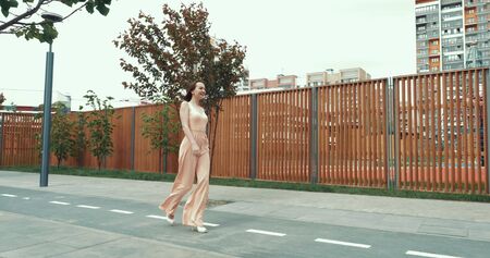 Young pretty woman walks outdoorsの写真素材