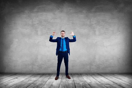 Smiling businessman pointing on himself by thumbs up gesture.の写真素材