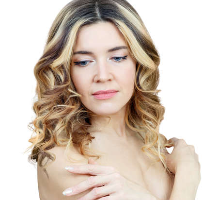 Beauty portrait of blonde woman with wavy hair.の写真素材