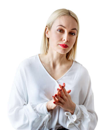 Portrait of beautiful serious adult woman in white blouse.の写真素材