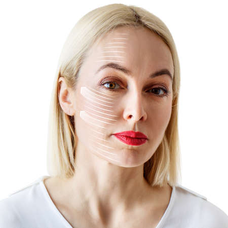 Graphic lines shows facial lifting effect on skin of beautiful woman.の写真素材