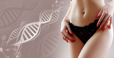Woman with perfect belly near DNA stems. Slimming concept.の写真素材