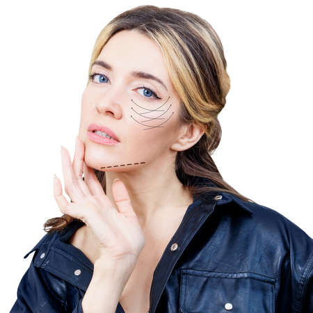 Beautiful woman with graphic lines shows facial lifting effect.の写真素材