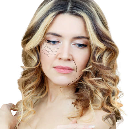 Graphic lines shows facial lifting effect on skin of beautiful woman.の写真素材
